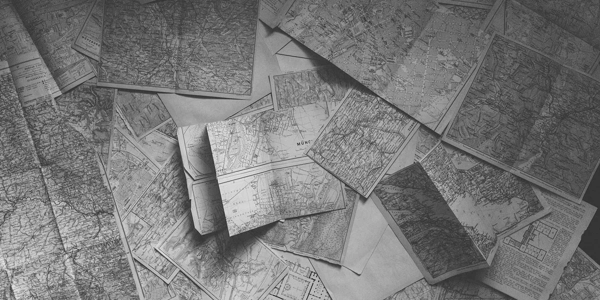 Retro road maps spread out on the floor